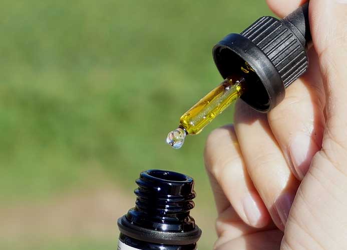 Bottle and dropper full of essential oil