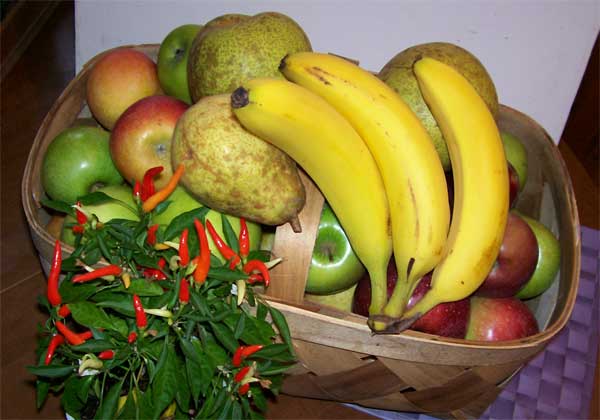 Fruit basket with apples, pears, and bananas