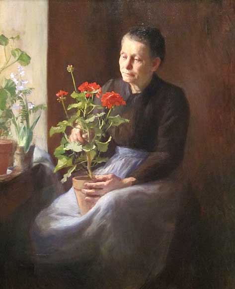 Woman with a pot of geraniums