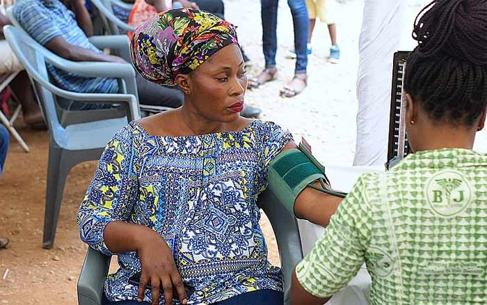 woman getting blood pressure checked