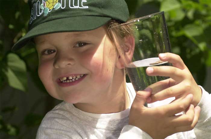 Boy with a glass of water