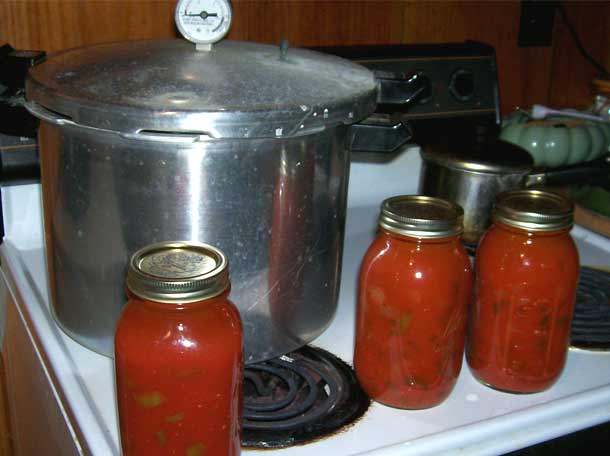 Pressure canner and jars of tomato sauce