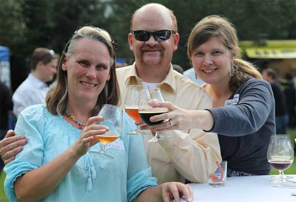 Three adults drinking alcholic beverages