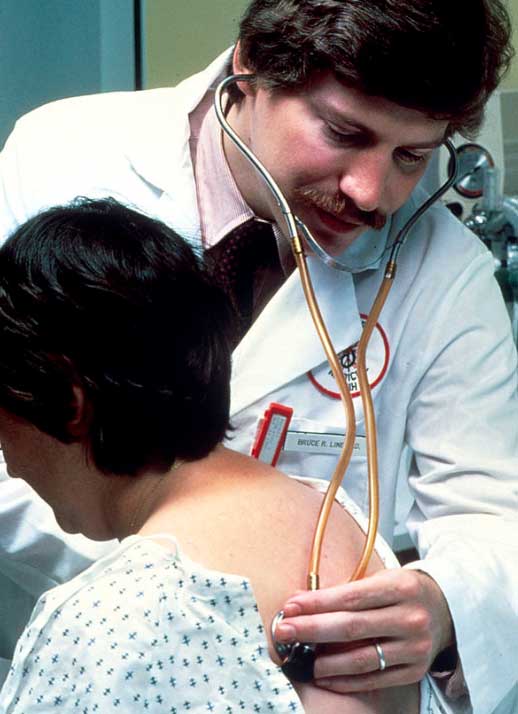 Doctor examines patient