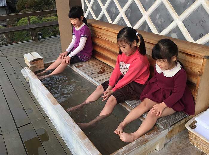 Children having a foot bath