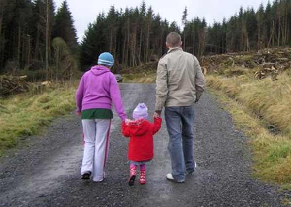 Family talking a walk in fresh air