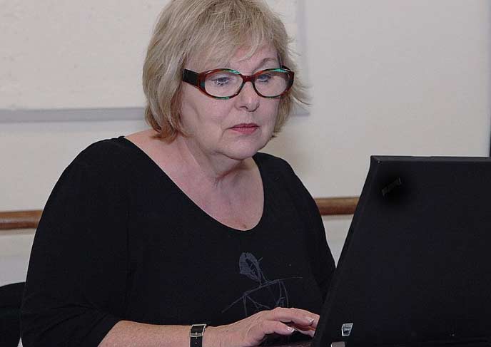 woman typing on a laptop