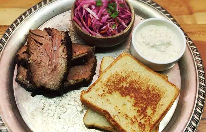 Horseradish sauce on a plate with beef