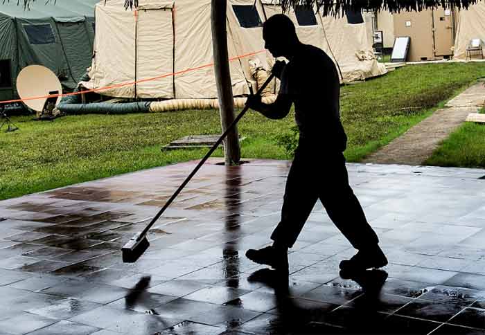 man cleaning a floor