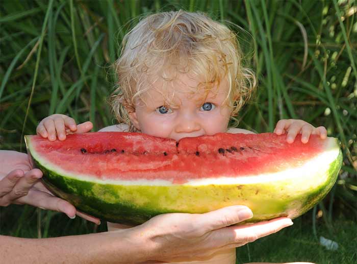 Baby eating watermelon