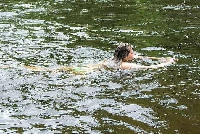 Woman swimming in a lake