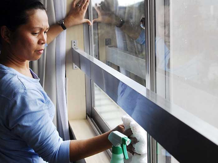 woman washing a window