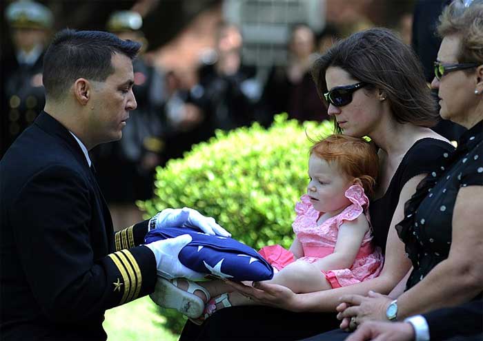 Widow at funeral