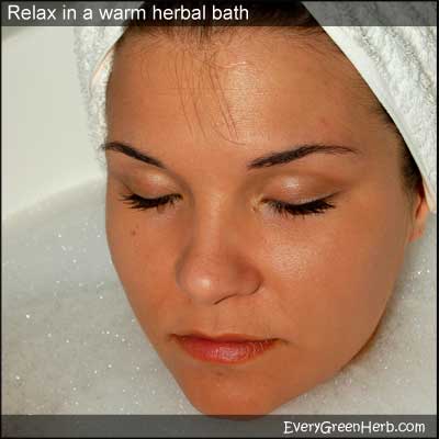 Woman takes a herbal bath